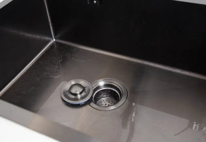 A clean kitchen sink and drain in Illinois