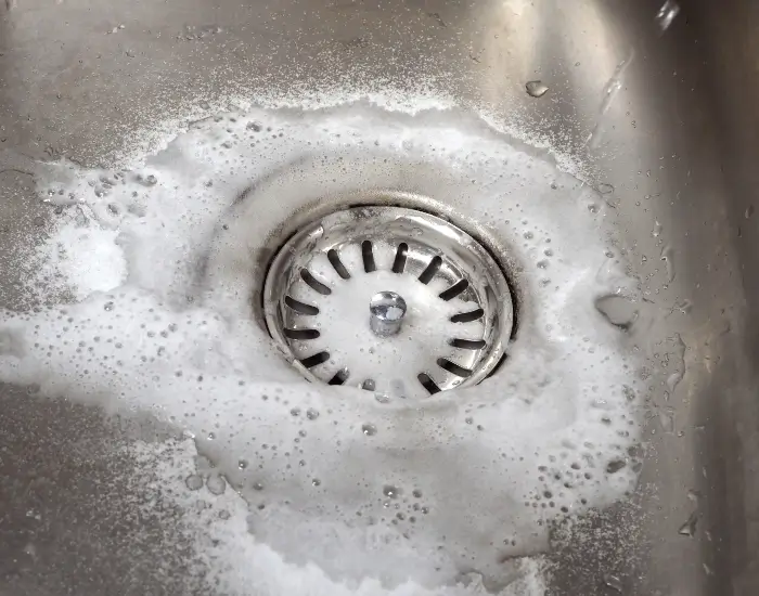 A drain after being cleaned with baking soda and vinegar